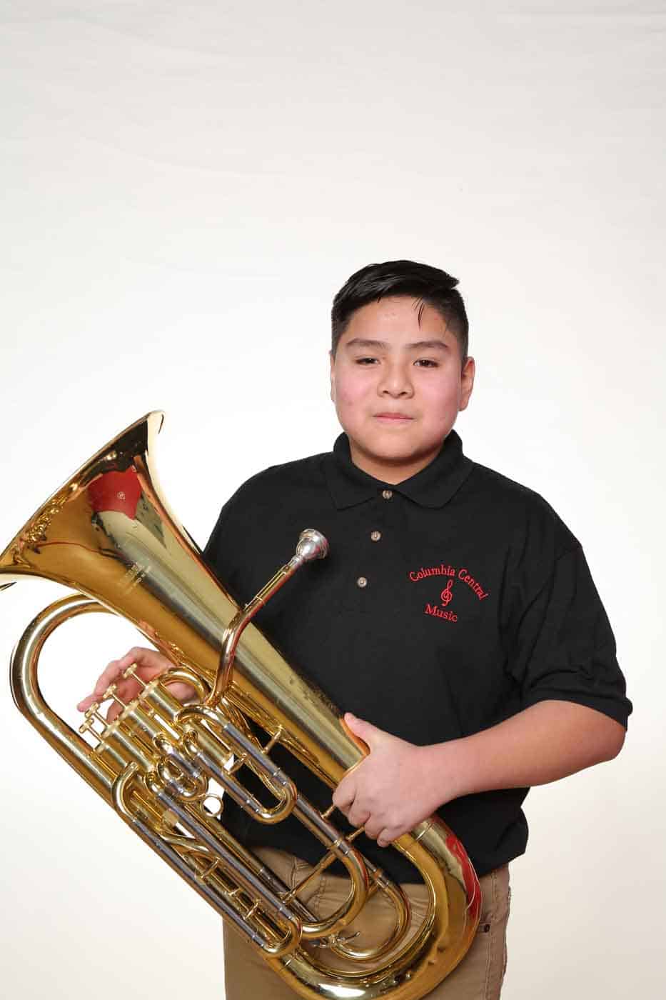 Young boy with brass instrument