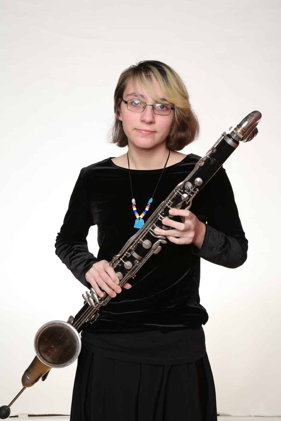 Young girl with woodwind instrument