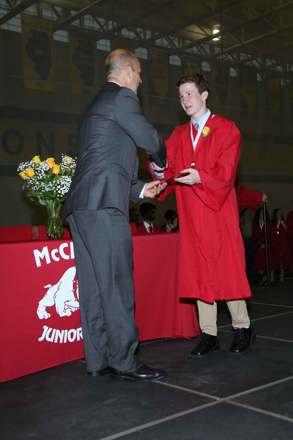 Boy receiving diploma