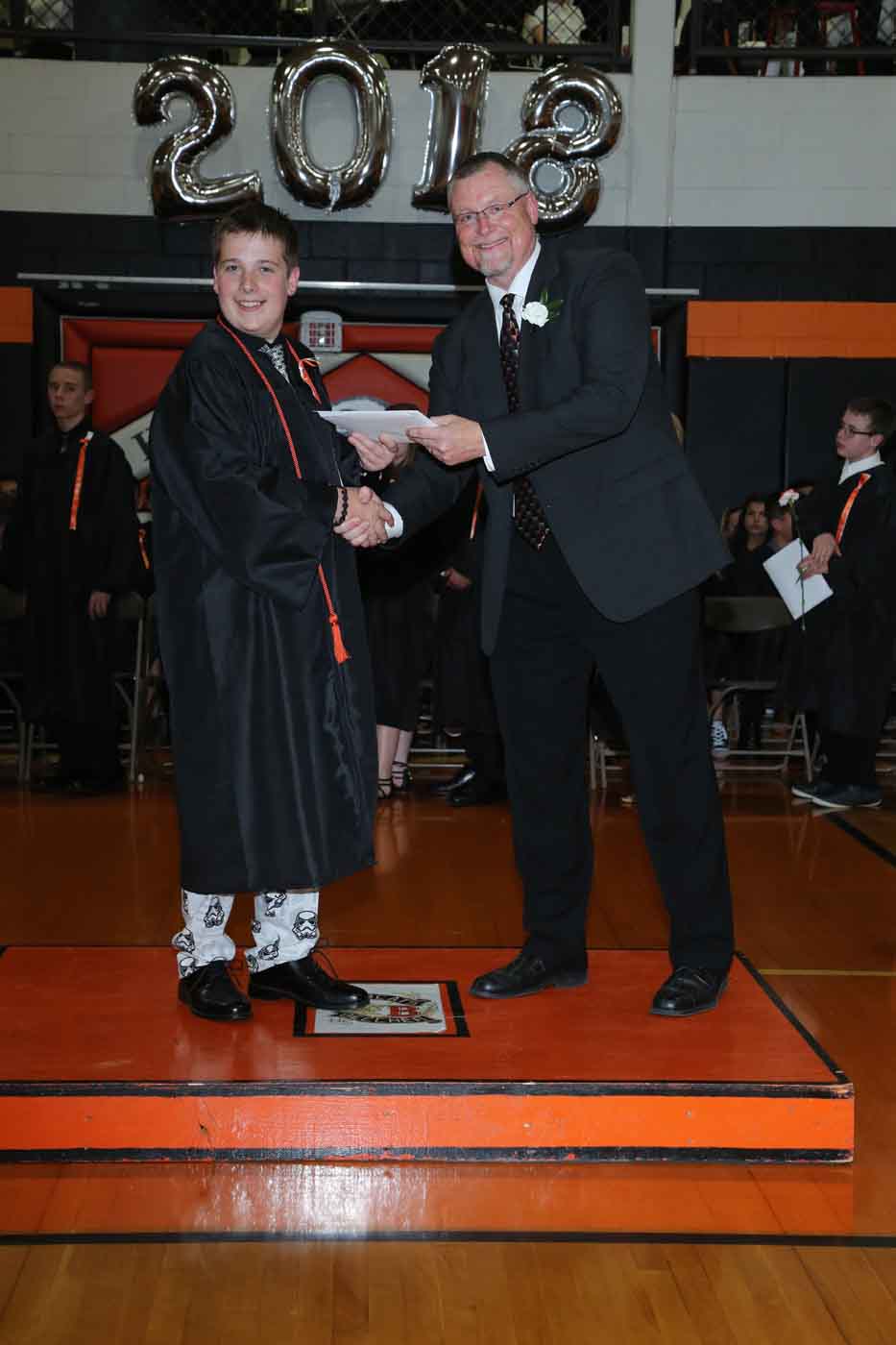 boy receiving diploma
