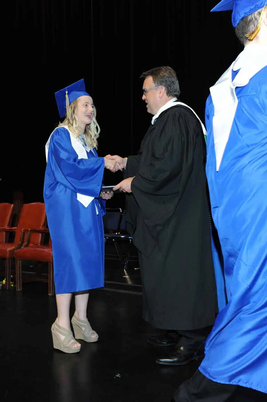 Girl receiving diploma