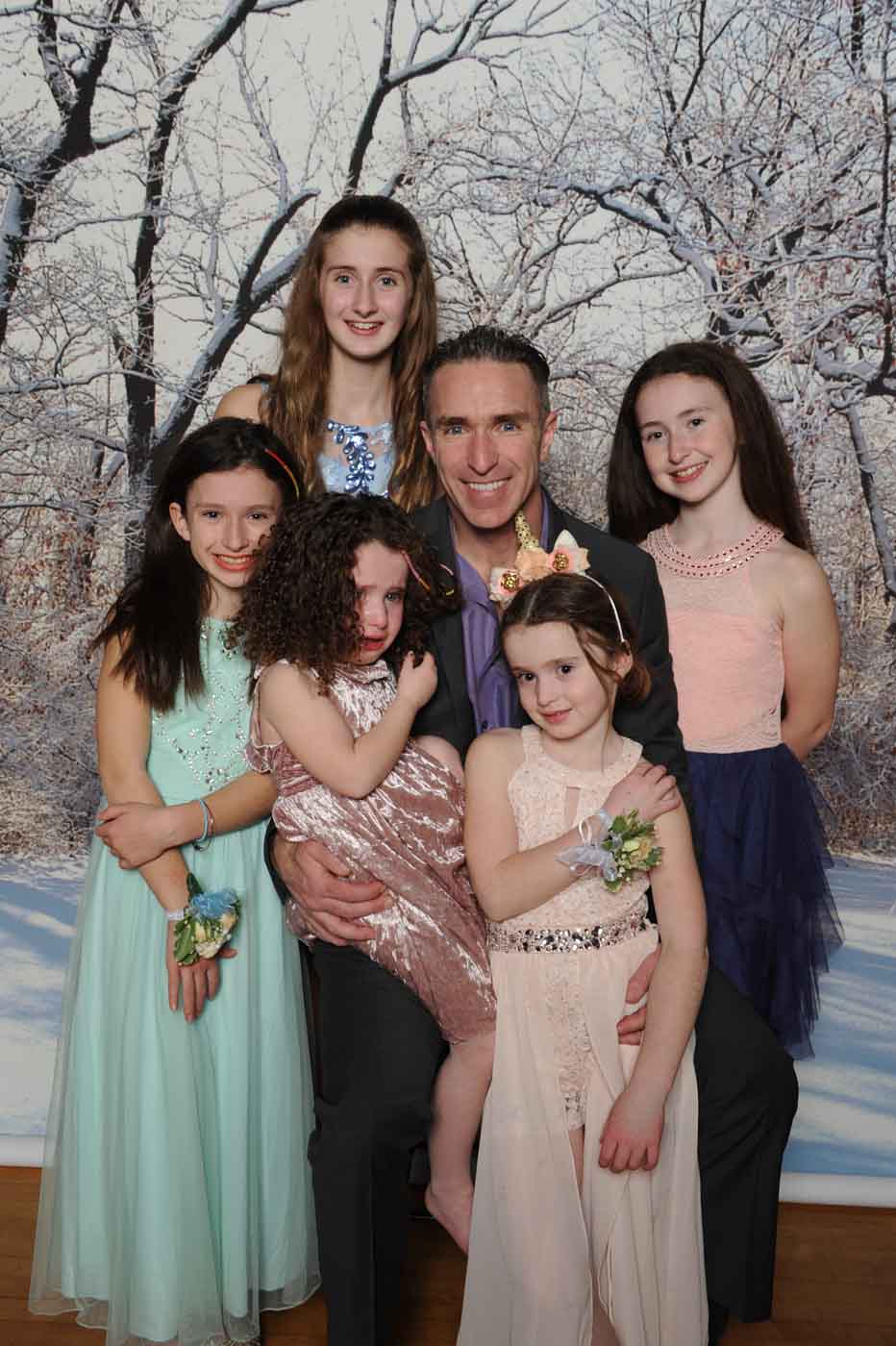 Man with 5 girls posing