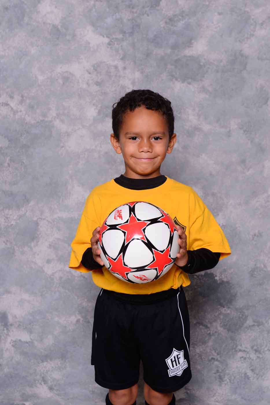Boy soccer player with ball