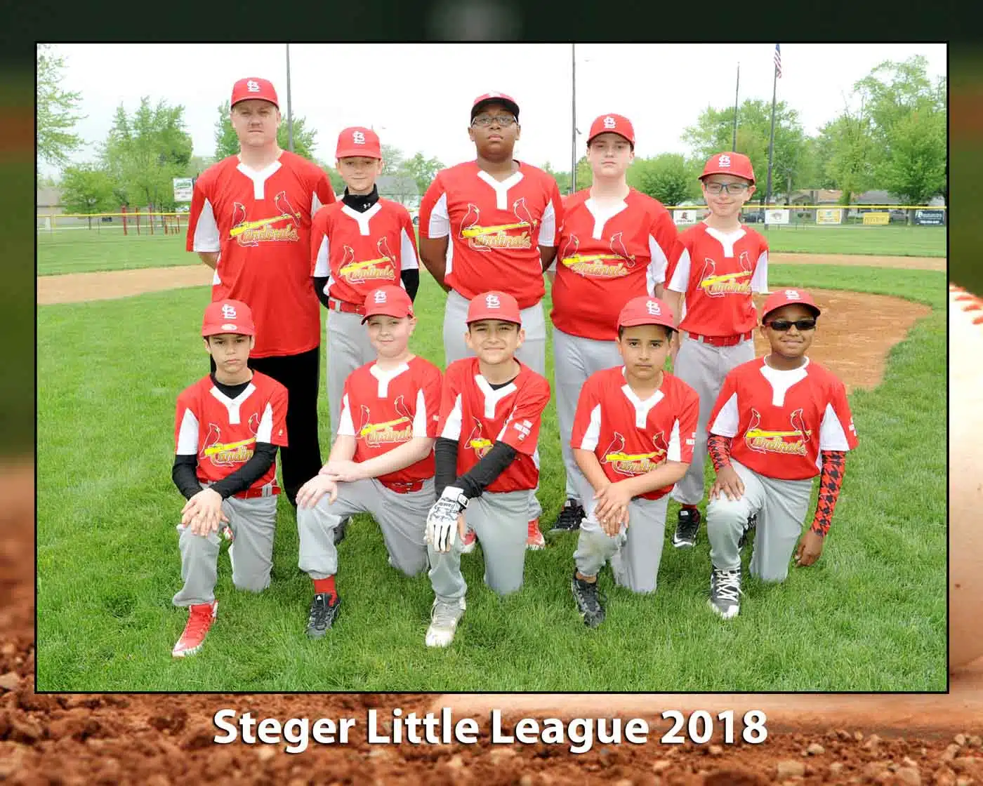 Steger Little league group in red uniforms pose