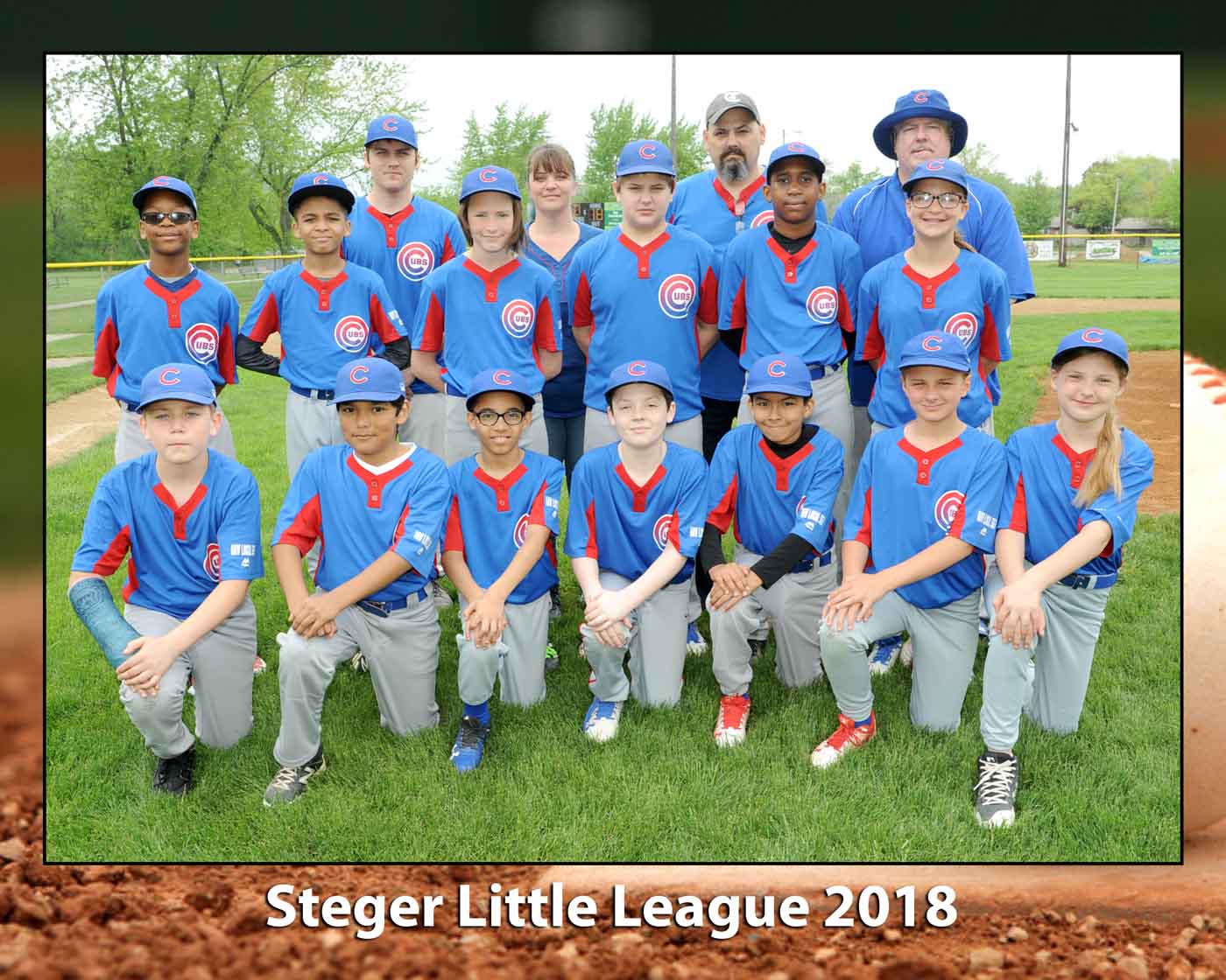 Steger Little league group in blue uniforms pose