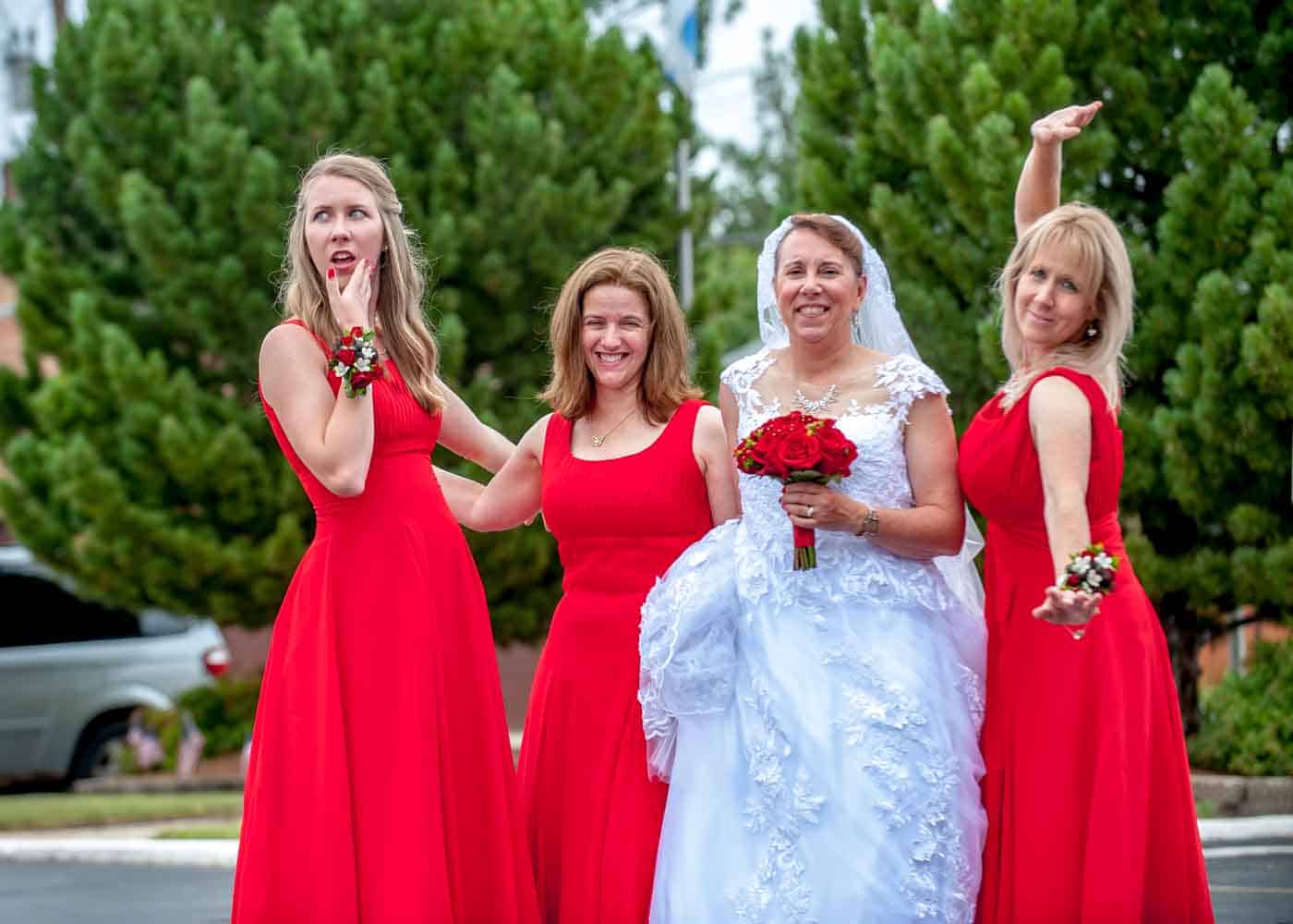Bride and 3 bridesmaids posing outside